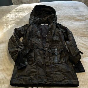 Blanc Noir raincoat with hood.